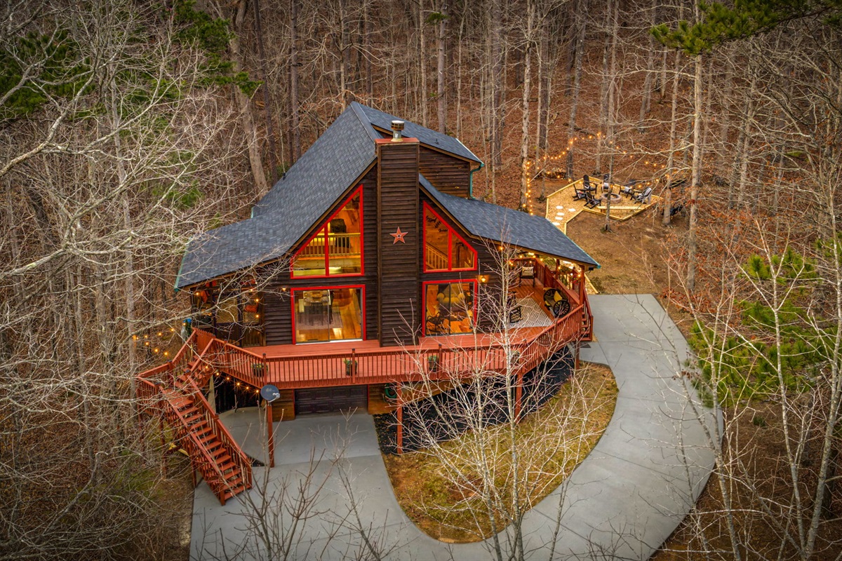 Soft lighting highlights the architectural details and enhances the home’s overall charm.