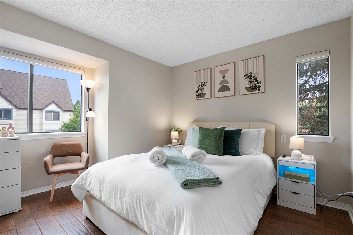 Luxury hybrid mattress, comfortable crisp linens, wall mounted smart tv, bedroom storage and walk in closet.