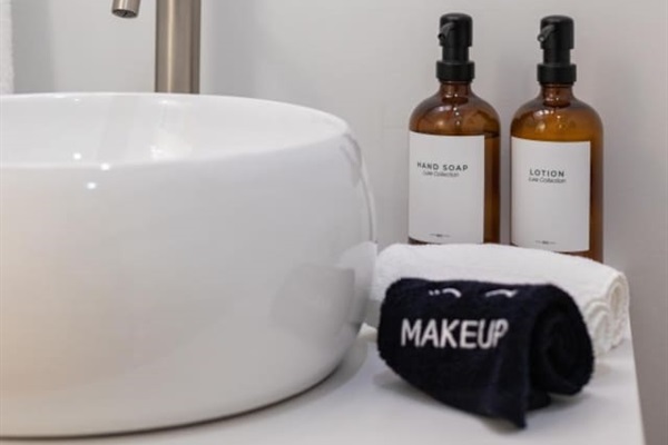 Experience luxury with premium toiletries and plush towels in our pristine bathroom.