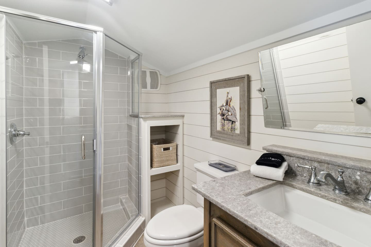 Walk-in shower in the loft ensuite &mdash; a clean, private space at the top of the home.	