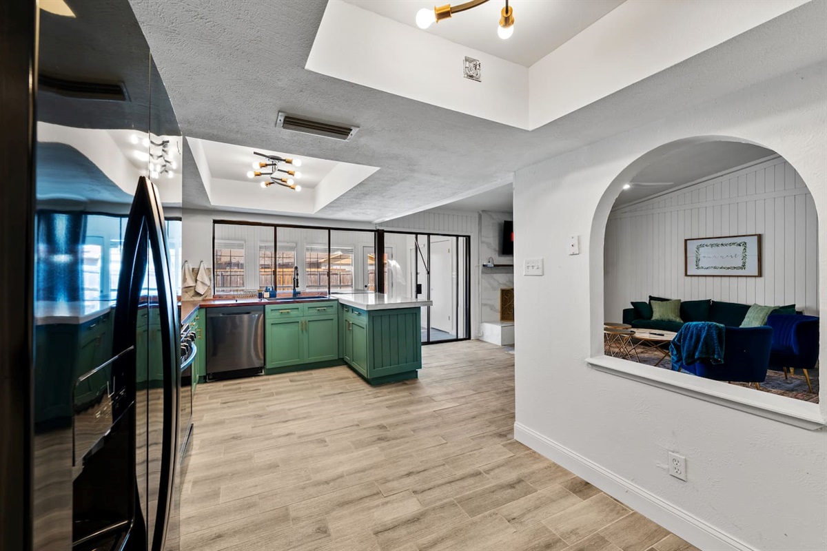 Bright, open kitchen with modern appliances and clean lines—perfect for cooking, entertaining, and staying connected to the group.