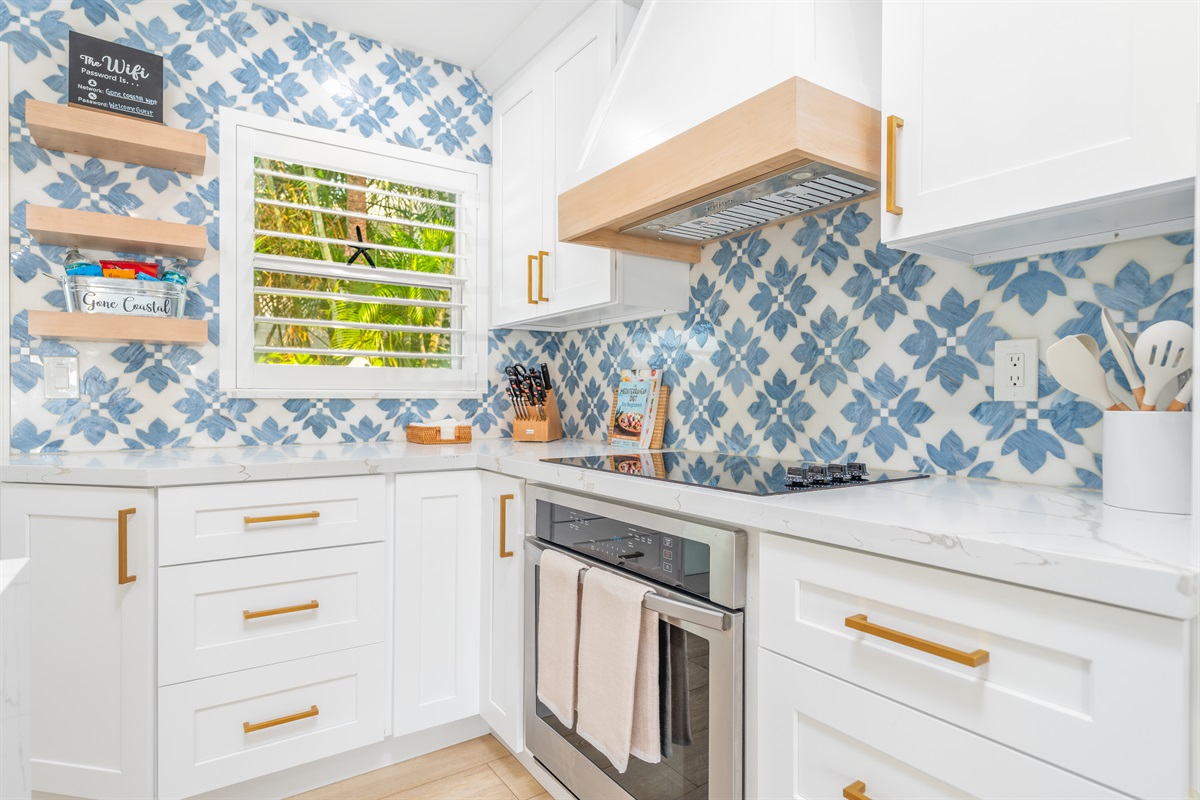 High-end stainless steel appliances and a gas range for gourmet home cooking.