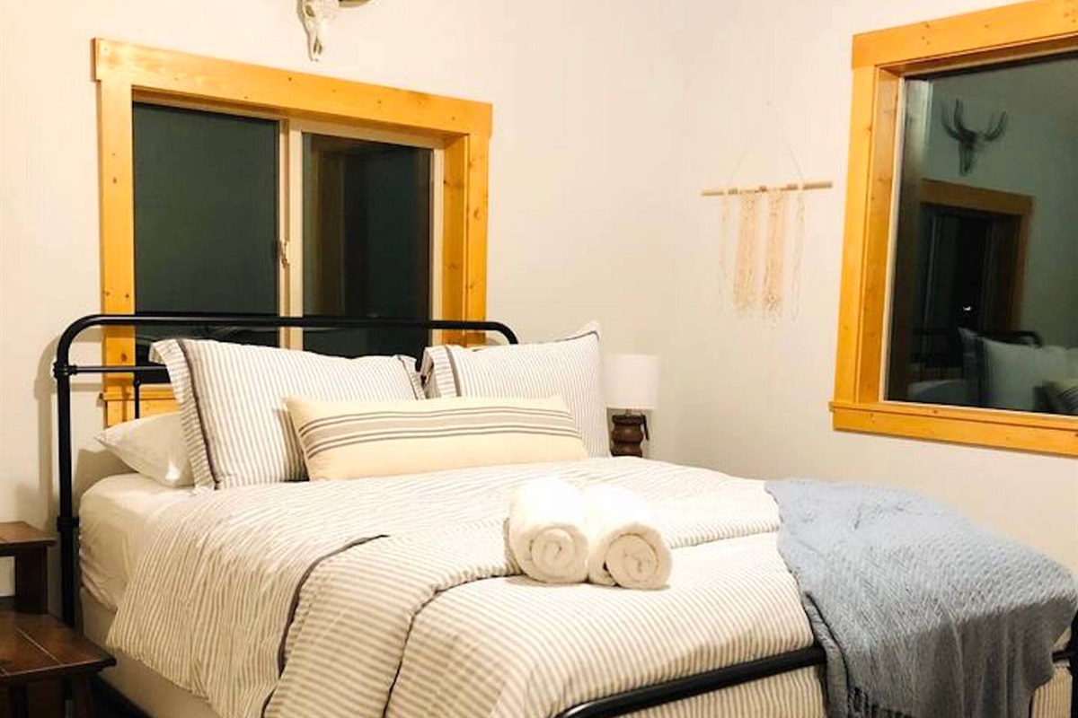 Two of the charming bedrooms feature a queen bed.