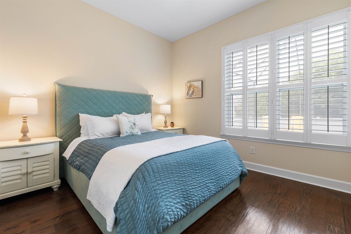 Sink into the soft blue bed after a sun-soaked beach day, sleep in behind the shutters, and wake refreshed for coffee and another easy coastal adventure waiting just outside your door.