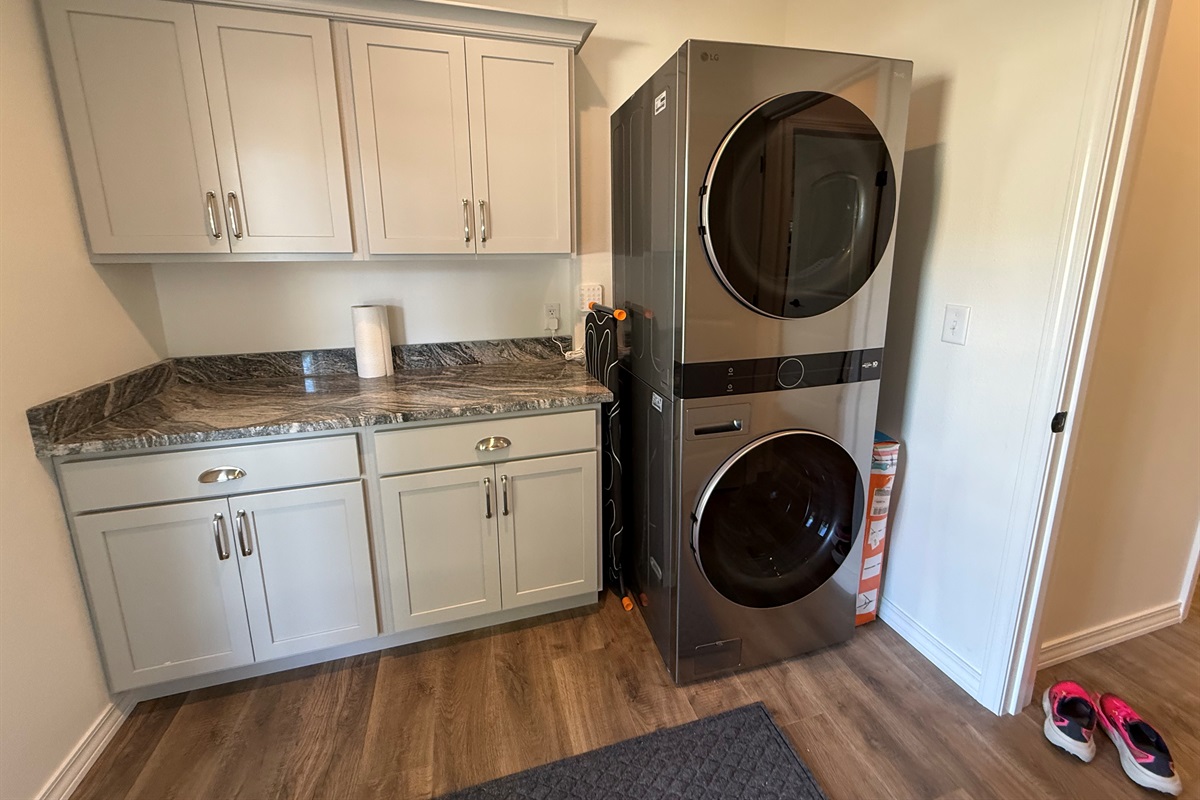 Washer/dryer with more cabinet and countertop space. Iron and iron board provided. 