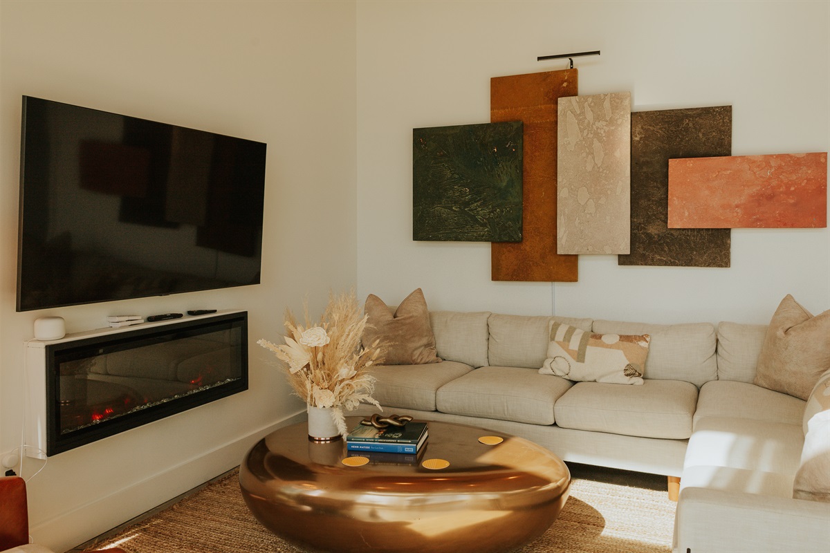 {Glass House Living} Cozy up by the electric Fireplace and enjoy the views or your favorite shows.