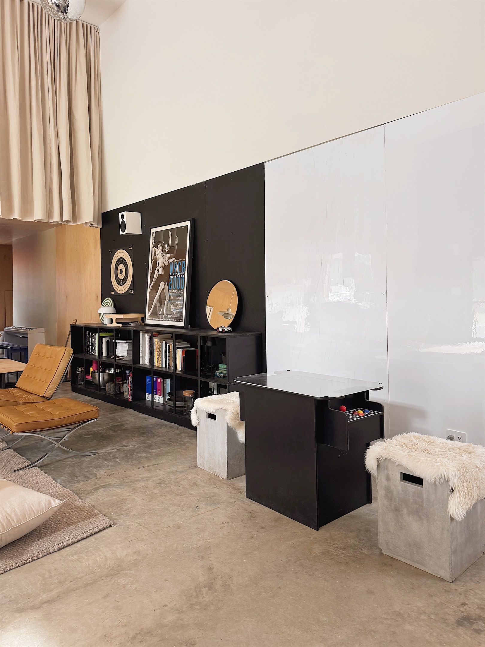 Arcade table with over 400 games, including Ms. Pacman and Frogger. 8x8 whiteboard wall behind.