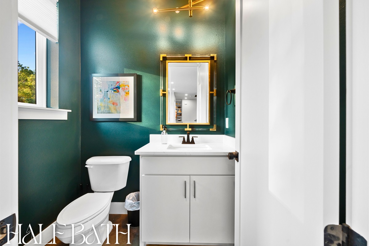 This charming half bath brings modern style to a small space, making it perfect for guests and quick refreshes.