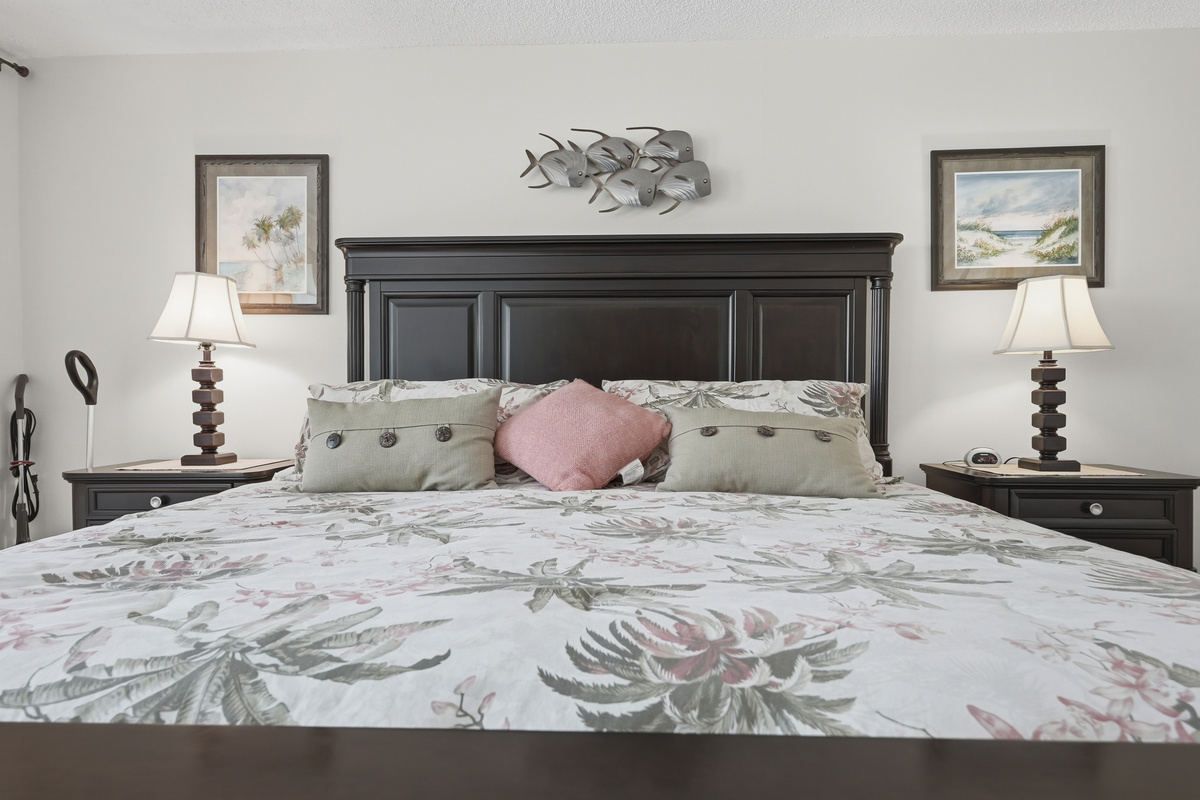 Settle into the comfort of the spacious main bedroom, featuring a king-size bed and a peaceful atmosphere designed for restful nights and easy mornings.