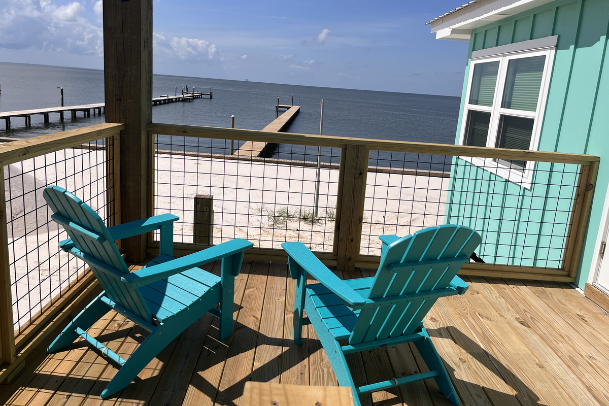 njoy one-of-a-kind views from the tranquil bay-side porch, the perfect spot to relax and take in the natural beauty surrounding the home.