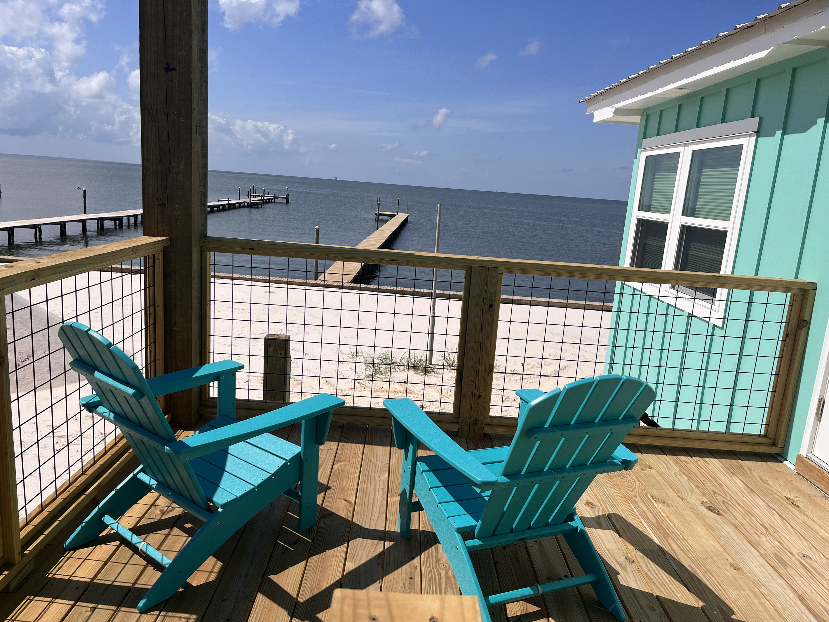 njoy one-of-a-kind views from the tranquil bay-side porch, the perfect spot to relax and take in the natural beauty surrounding the home.