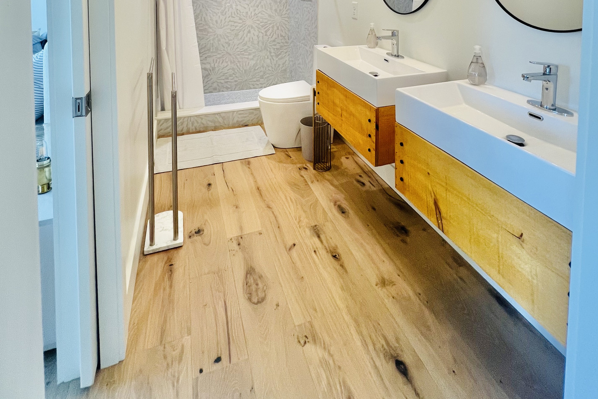 Thoughtfully designed for sharing.
This lower-level bathroom features double vanities and a spacious shower, with convenient access from both the rec room and the queen bedroom—making it easy for families and groups to spread out and relax at Hidden Point 
