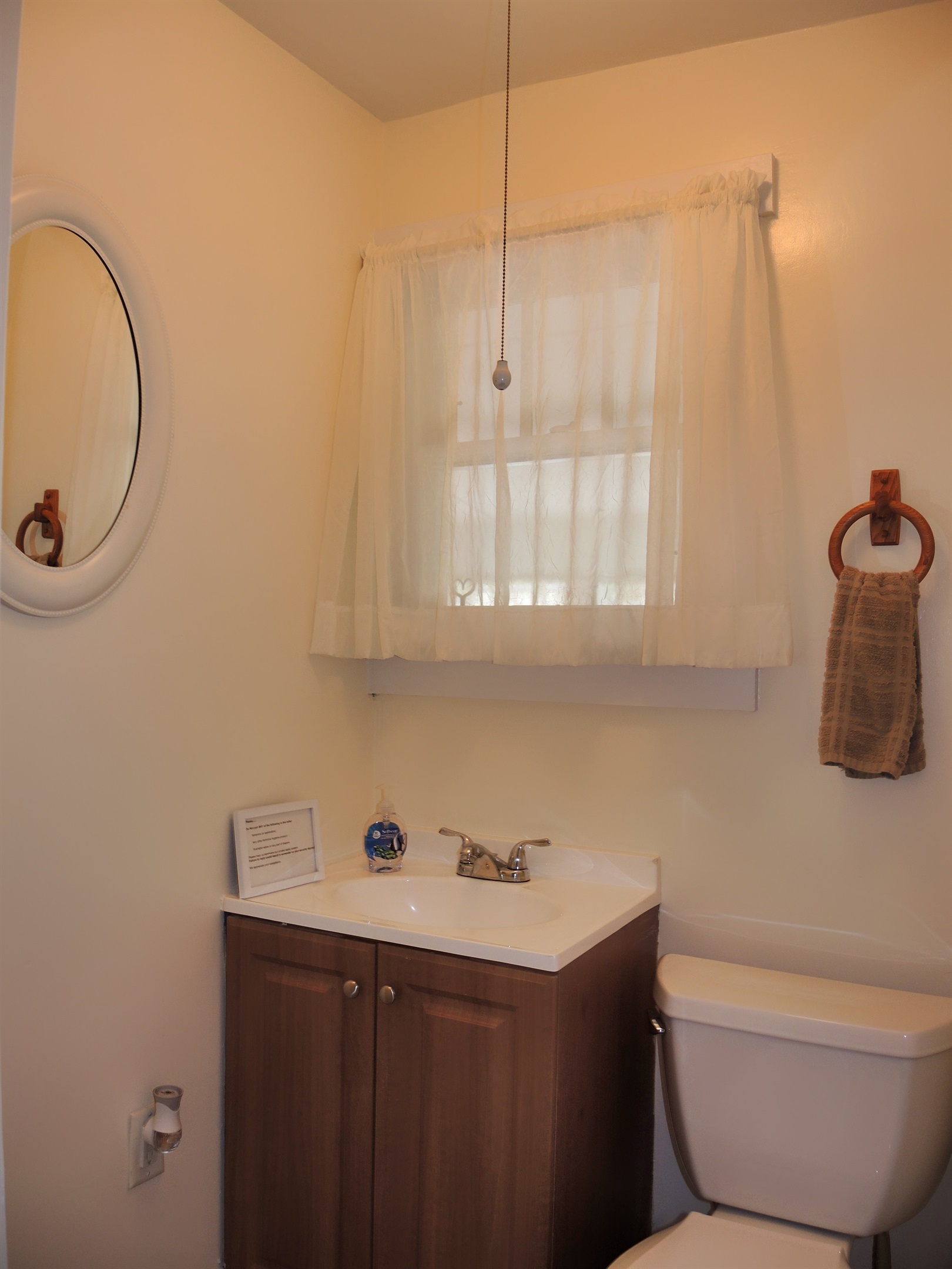 1st floor - half bathroom just off the kitchen.