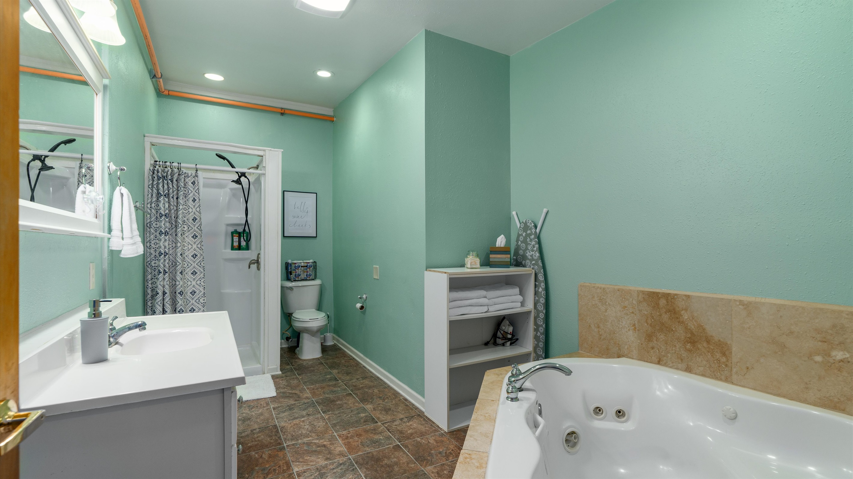 The large bathroom features a jetted tub for two!