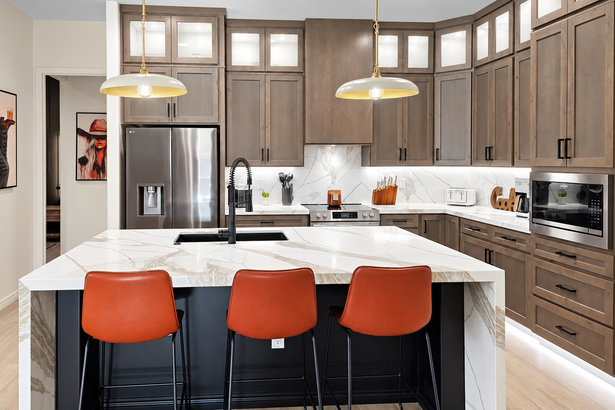 Oversized kitchen island with barstools.