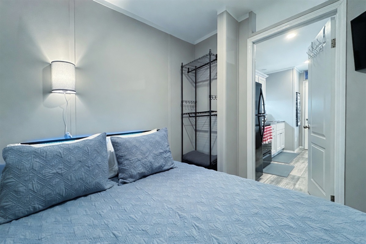 Bedroom #2 with queen bed, smart TV and en suite bathroom