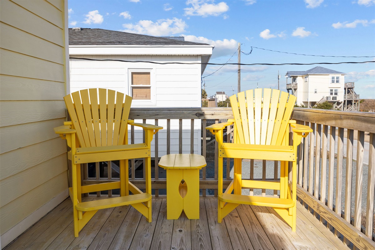Bright Adirondack seating for laid-back coastal lounging