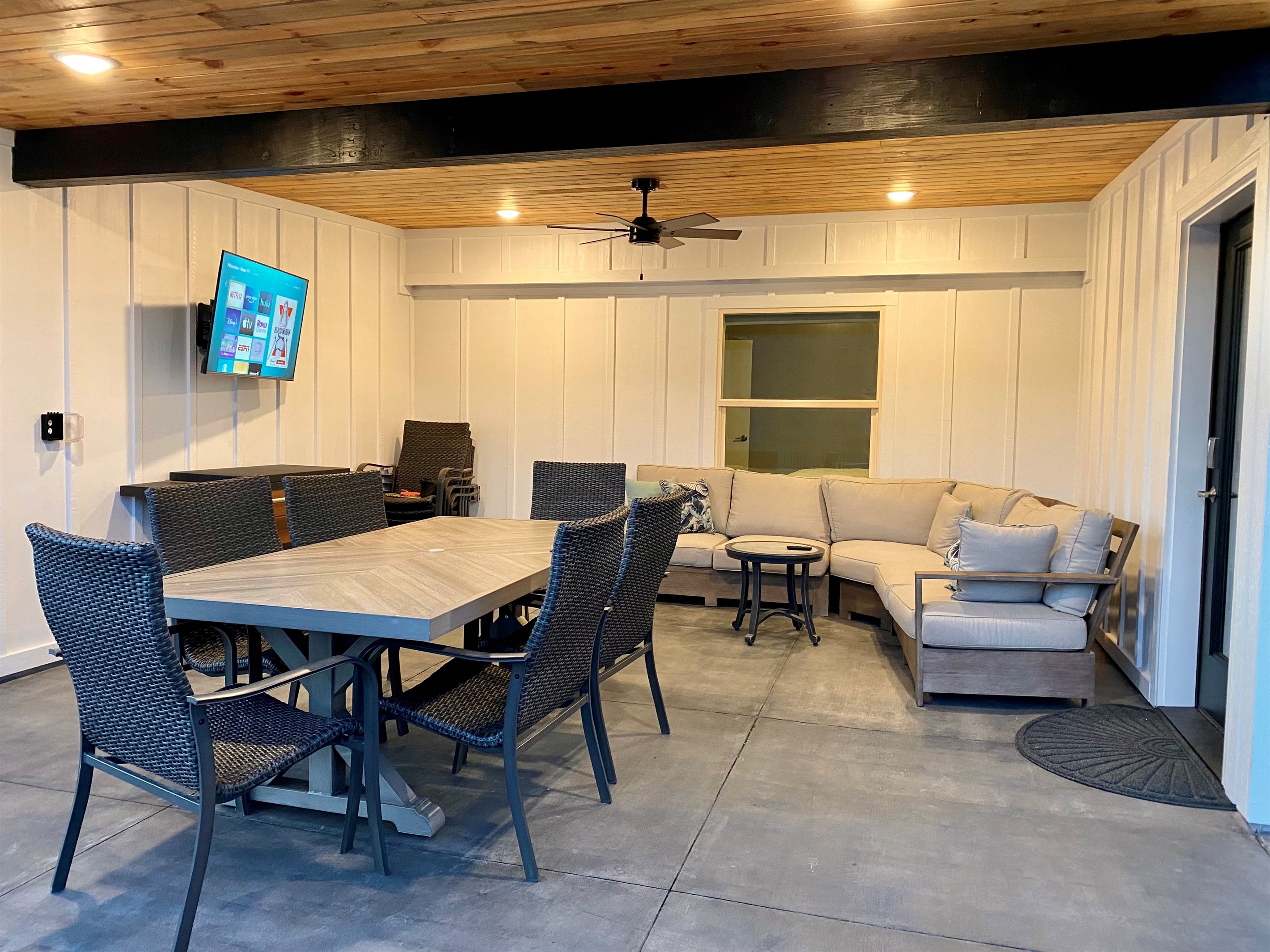 Covered outdoor living space with TV