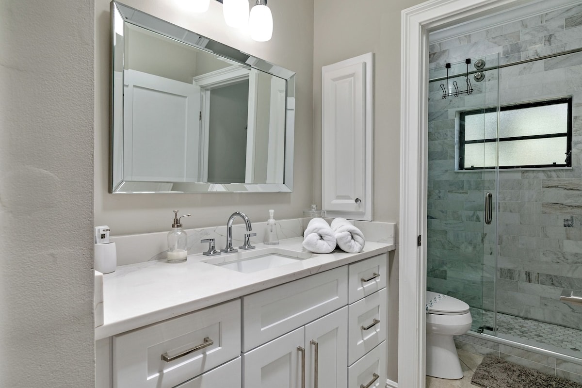 Full bathroom featuring a sleek walk-in shower for a refreshing start or end to your day.