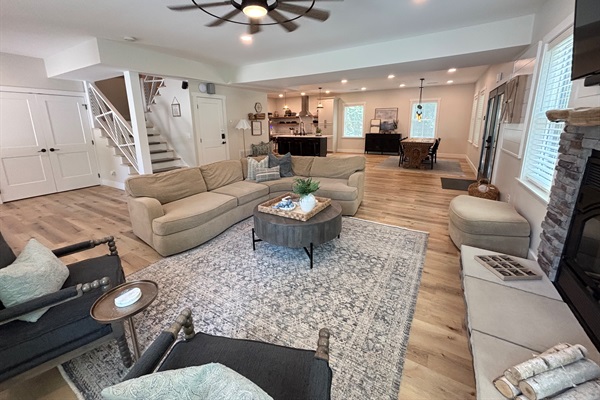 This spacious living area invites relaxation with its comfortable seating, stylish decor, and warm ambiance. Perfect for family gatherings or a quiet night in.