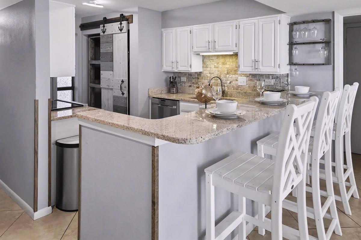 Counter seats with outdoor style seats by the kitchen and dining area