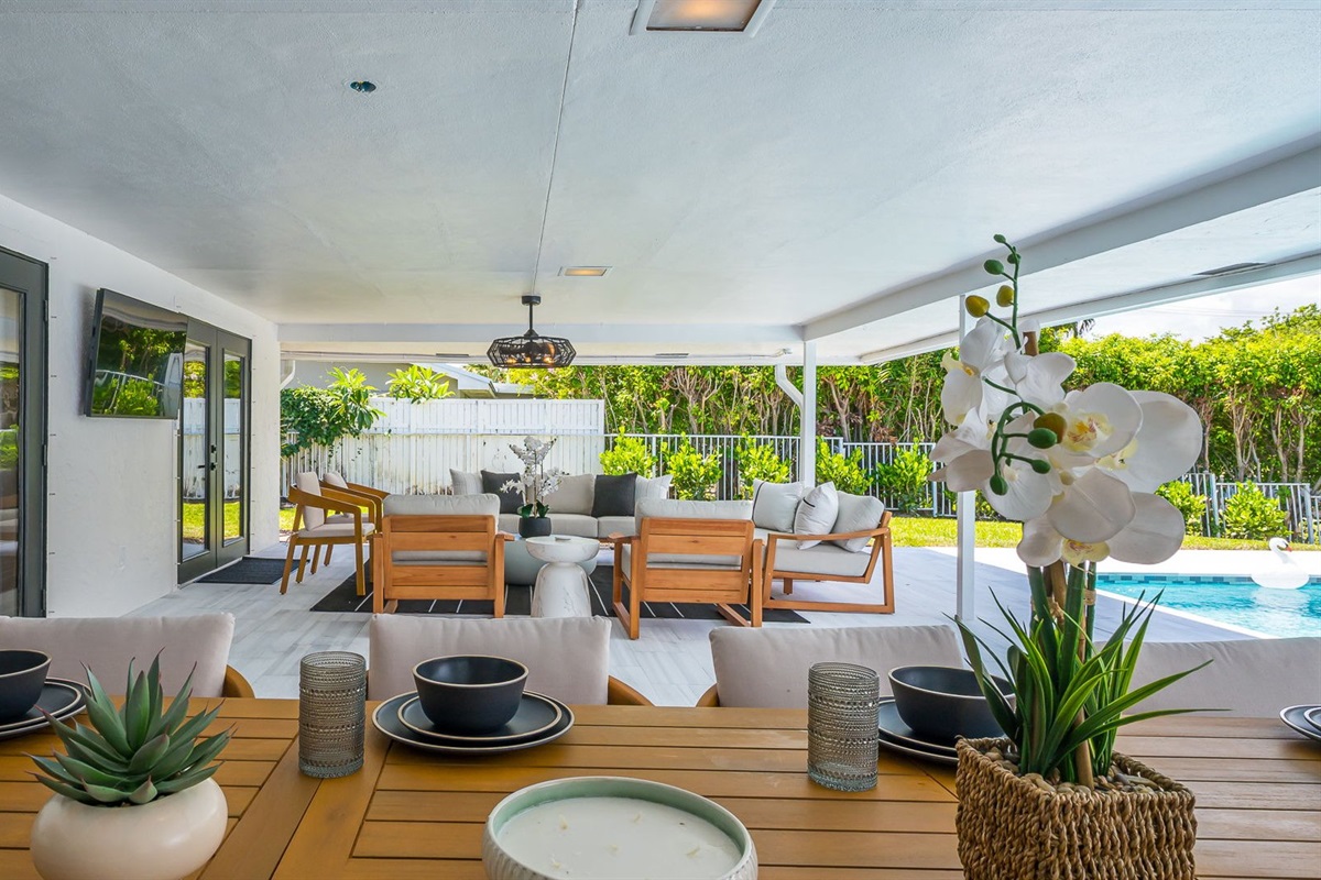 Designed for luxury and comfort, this outdoor space invites you to dine, relax, and unwind in true resort fashion. Enjoy poolside loungers, shaded patio seating, and an ambiance that blends modern elegance with the ease of Florida living