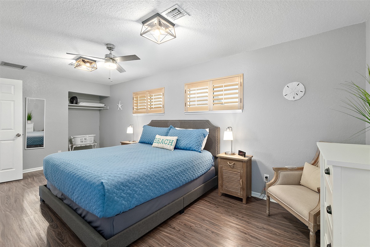 Spacious primary suite with king bed and ocean light