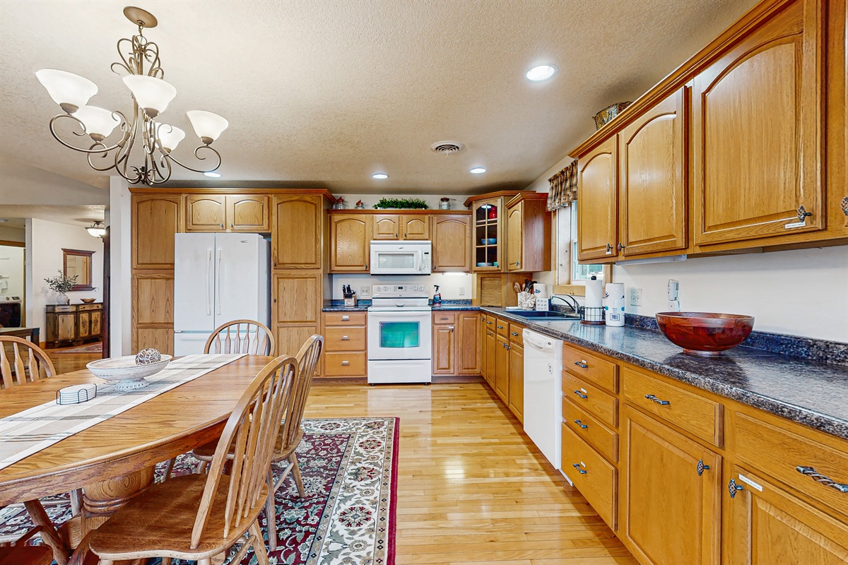 Open concept kitching with jaw dropping views! Large dinning table + breakfast bar with seating for 14