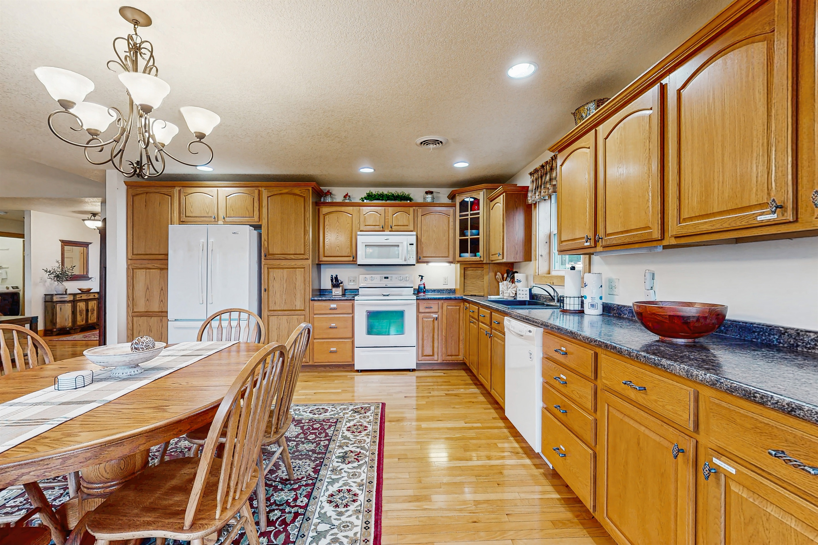 Open concept kitching with jaw dropping views! Large dinning table + breakfast bar with seating for 14