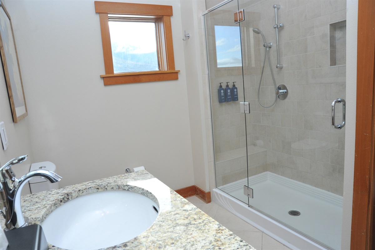 Bathroom #1 of 2: ensuite bathroom to the primary bedroom with walk in shower