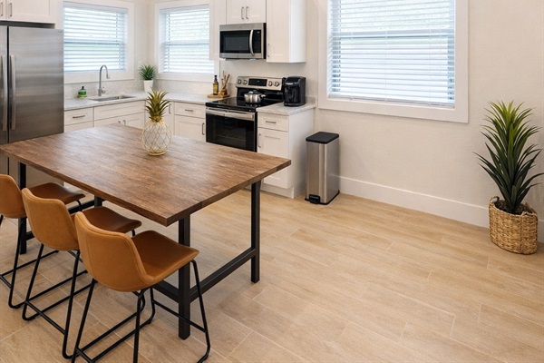 Dining room with vaulted ceilings. Create and eat amazing meals with this fully stocked kitchen