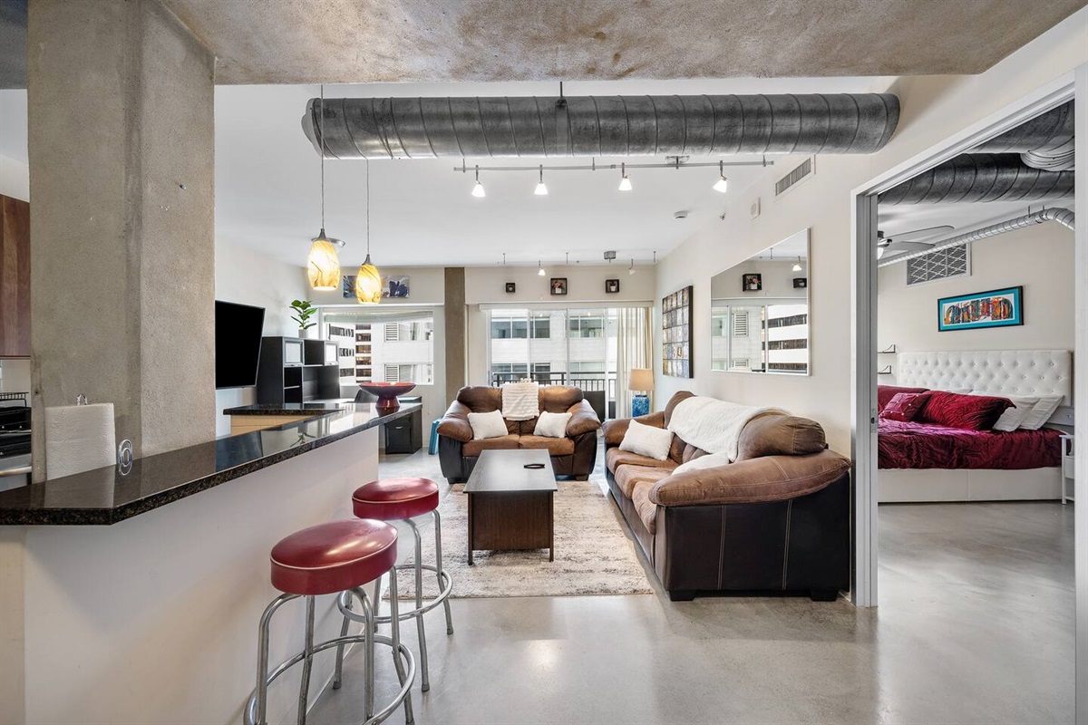 Spacious living room with 65" Curved TV