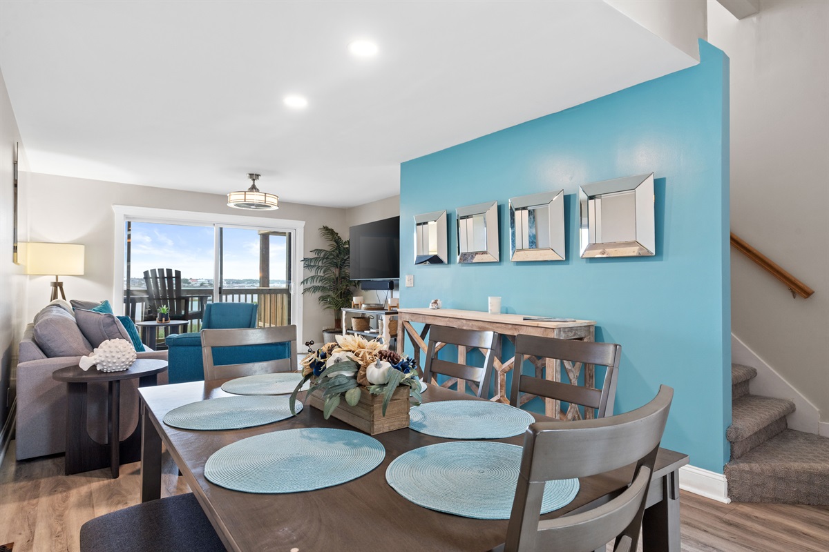 Gather, dine, and connect in a bright open space that flows into the living area