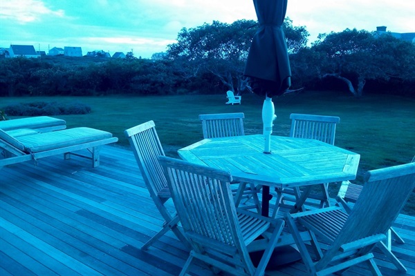 2nd deck downstairs at dusk, overlooking the side yard. 