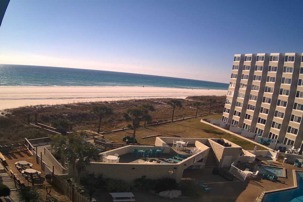 View of resort pool and sundeck with private beach access
