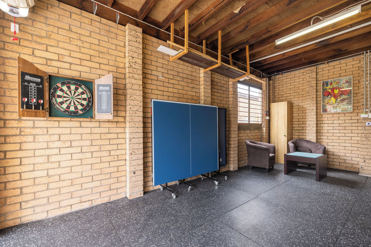 The games area at Luna’s Sanctuary features table tennis, darts, seating and open floor space for relaxed indoor activity.