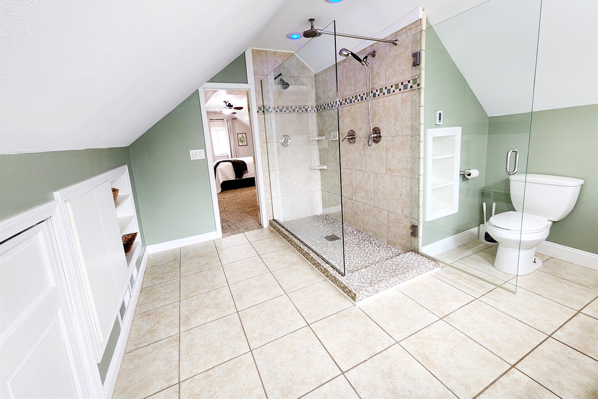 Large tile shower with three shower heads!
