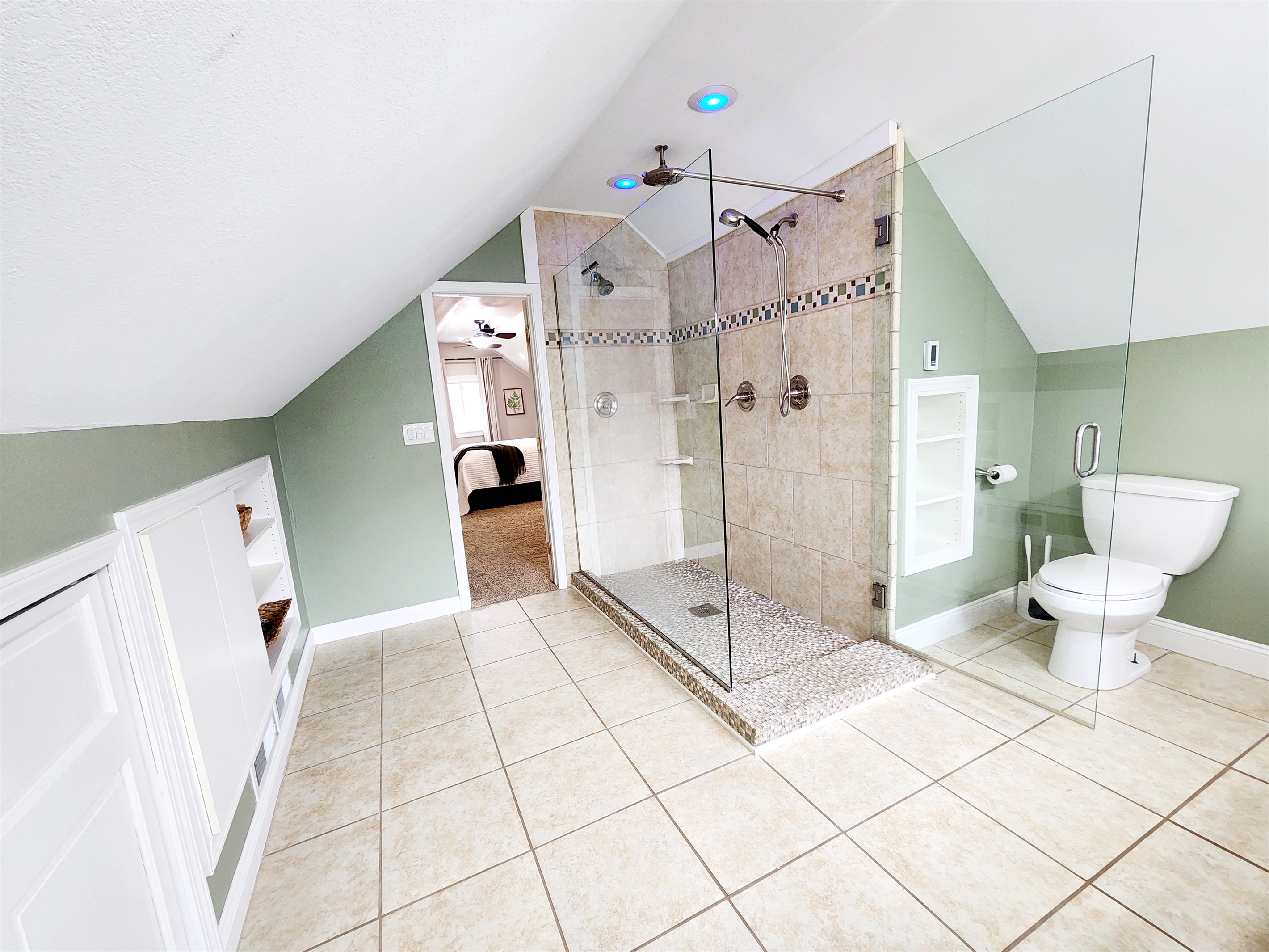 Large tile shower with three shower heads!