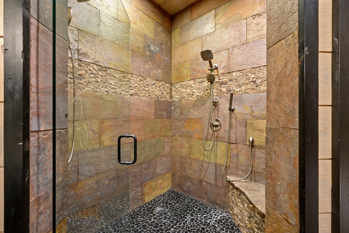 Oversized shower with multiple shower heads.