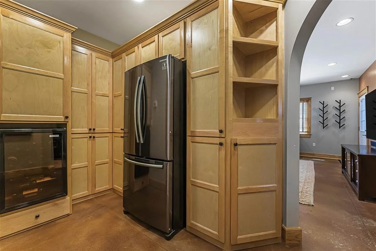 The lower level refrigerator keeps snacks and beverages cold.