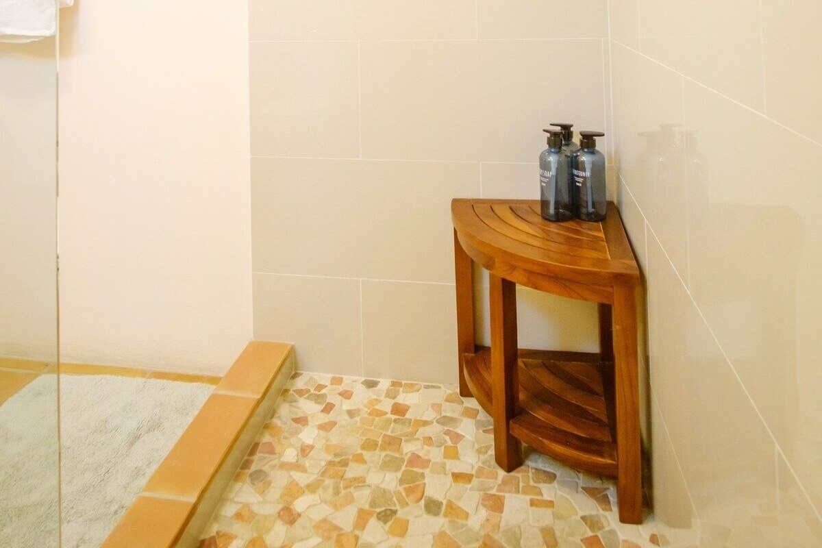 Teak seat in the shower.