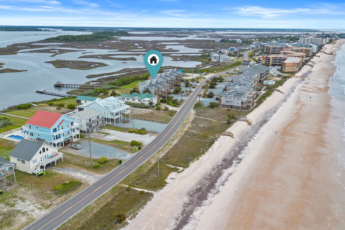 Aerial view of Trini Breeze at 1771 New River Inlet Rd&mdash;sound behind, ocean right across the street