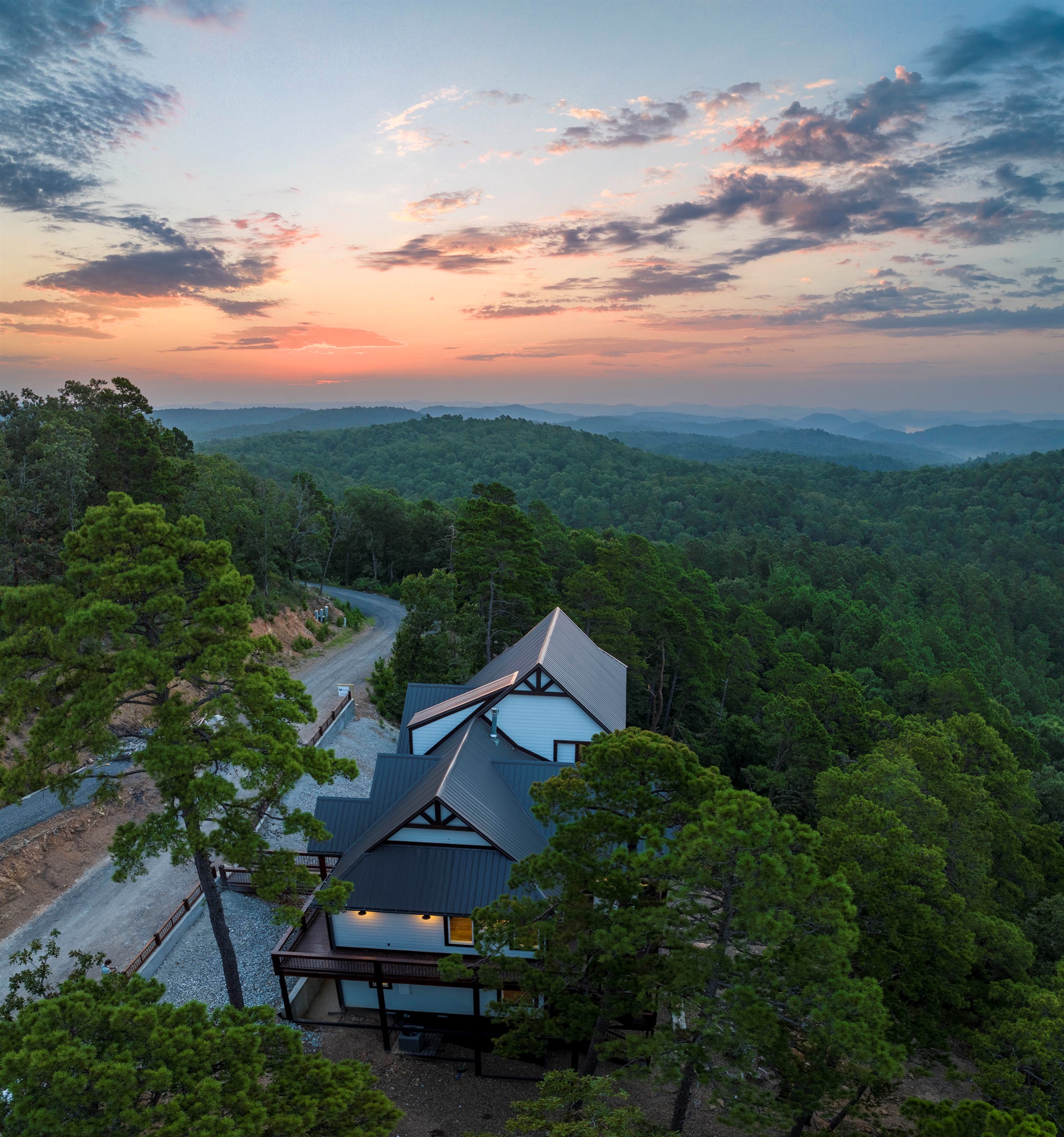 Aerial mountain view showcasing the cabin’s peaceful forest setting