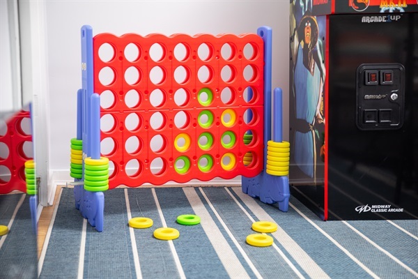 Kick back in the family room with a 75” Smart TV, oversized comfy couch, cozy LED fireplace, arcade game, and giant Connect 4. Endless fun for kids and grown-ups alike.