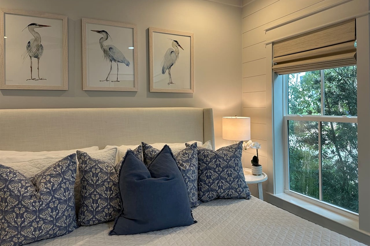 Spacious main level king bedroom suite with full ensuite bathroom, tiled shower and dual vanity sinks