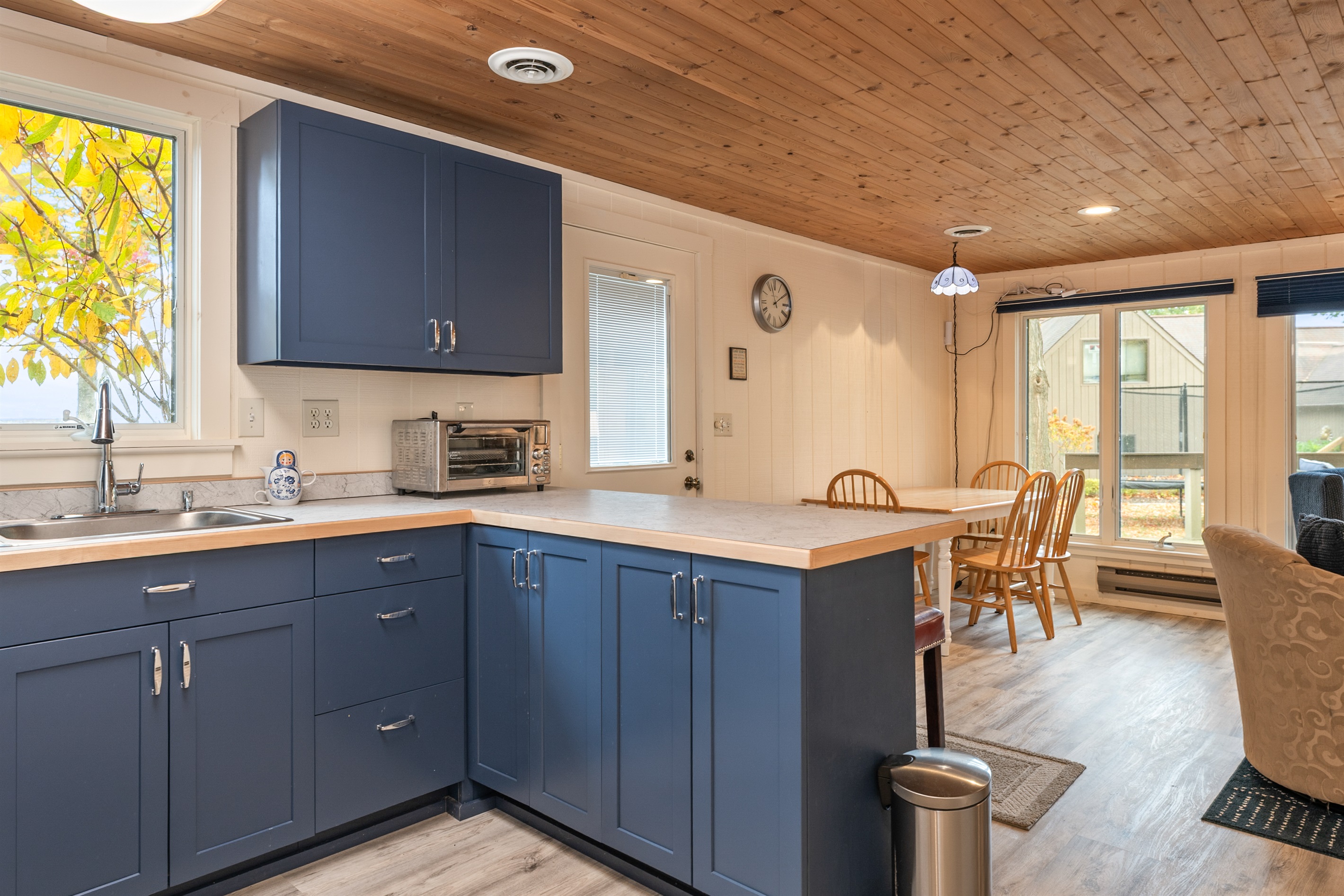Charming eat-in kitchen with plenty of natural light and warm wood details.