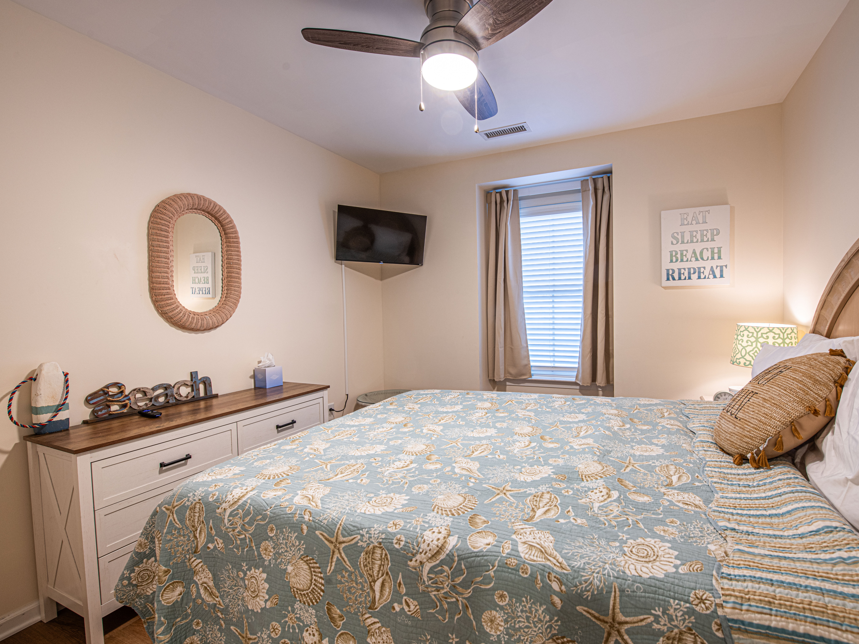 Bedroom 2 with White Dresser, and Wall-Mounted TV