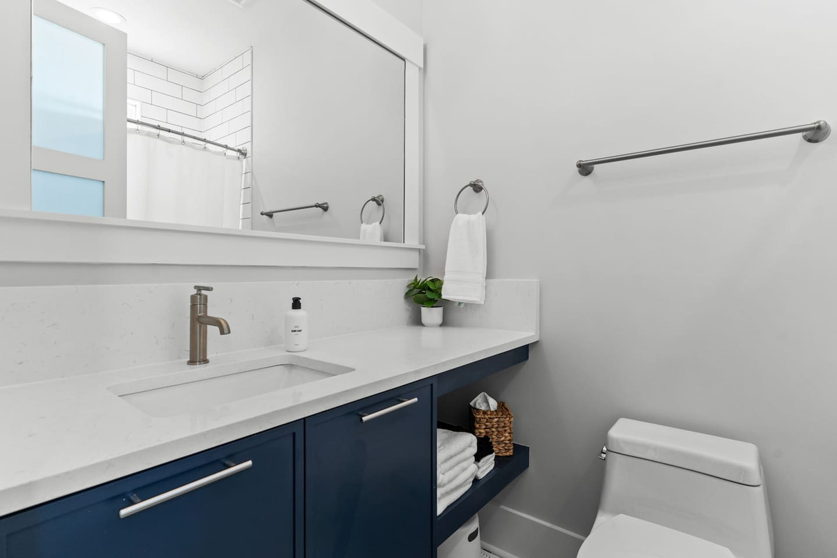 Thoughtful touches make every stay easier. This private en-suite bathroom comes stocked with essentials like hand soap, makeup cloths, tissues, and more.
