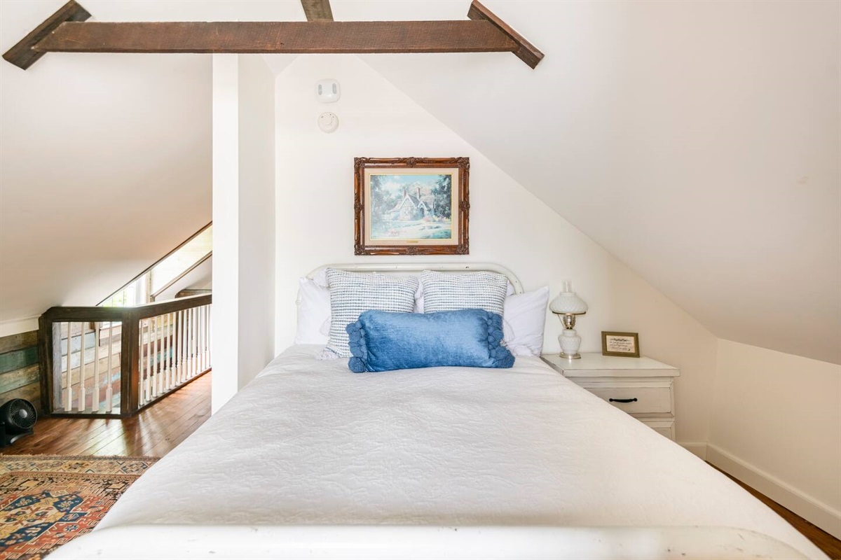 The loft area has a Full size bed and access to a half bathroom.