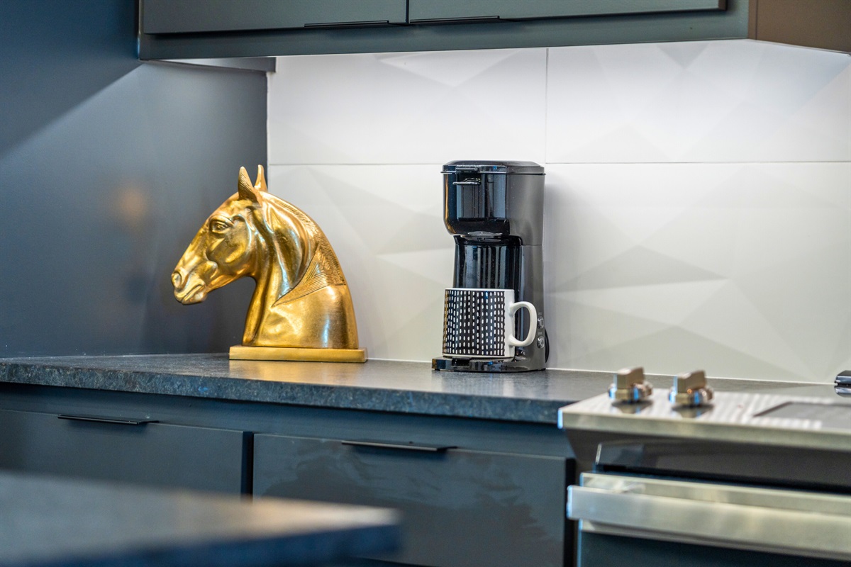 Start your day in style with this chic coffee station, where a touch of gold adds charm and convenience to your morning routine.